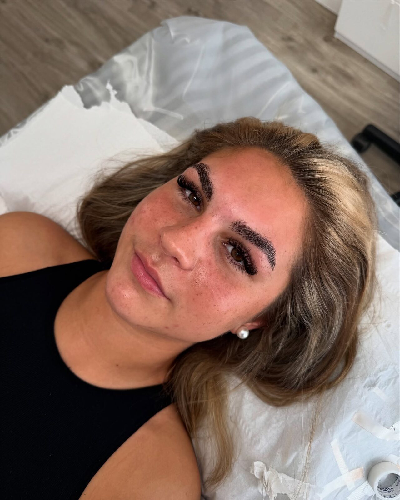 brow and lash result on a blonde client